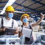 factory-workers-with-face-masks-protected-against-corona-virus-doing-quality-control-production-factory-Custom.jpg