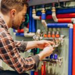 young-engineer-adjusting-autonomous-heating-Custom.jpg