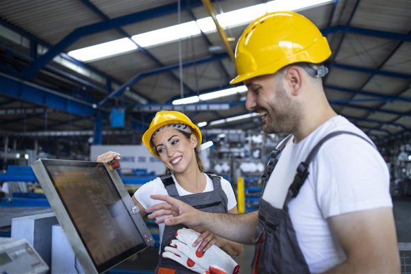 factory-worker-explaining-trainee-how-operate-industrial-machine-using-new-software-touch-screen-computer-Custom.jpg