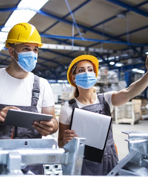 factory-workers-with-face-masks-protected-against-corona-virus-doing-quality-control-production-factory-Custom.jpg